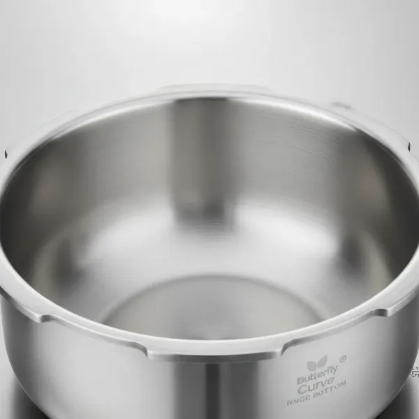 A detailed view of the unique bulge bottom of the Butterfly Curve pressure cooker.