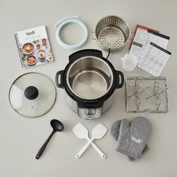 Yedi 9-in-1 pressure cooker with all its deluxe accessories neatly displayed.